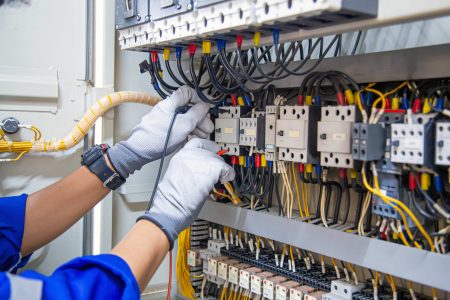 electricity-electrical-maintenance-service-engineer-hand-holding-ac-voltmeter-checking-electric-current-voltage-circuit-breaker-terminal-cable-wiring-main-power-distribution-board (1)